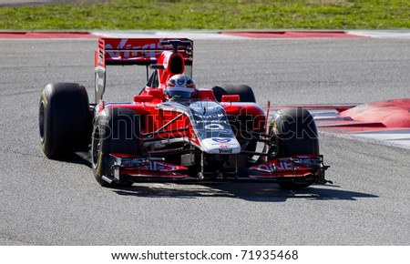 BARCELONA - FEBRUARY 18: Jerome D\'Ambrosio (Virgin) tests his new F1 car during Formula One Teams Test Days at Catalunya circuit February 18, 2011 in Barcelona (Spain).