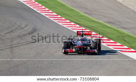 BARCELONA - FEBRUARY 18: Jenson Button (McLaren) tests his new F1 car during Formula One Teams Test Days at Catalunya circuit February 18, 2011 in Barcelona (Spain).