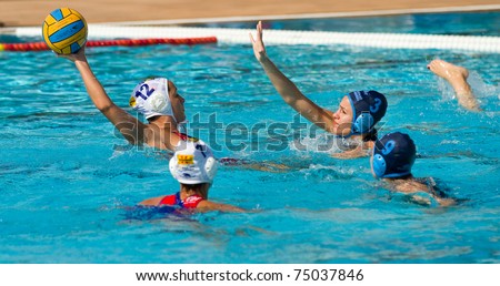 BARCELONA - APRIL 10: Water polo players in action during the women Spanish league match between CN Mataro and Sant Andreu, final score 4 - 7. April 10, 2011 in Mataro (Spain).