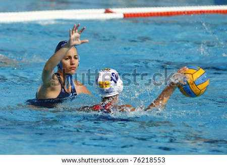 BARCELONA - APRIL 10: Unidentified water polo players in action during the women Spanish league match between CN Mataro and Sant Andreu, final score 4 - 7. April 10, 2011 in Mataro (Spain).