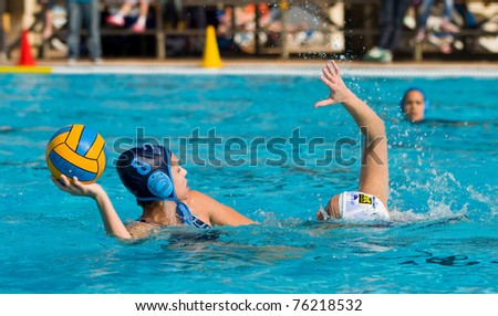 BARCELONA - APRIL 10: Unidentified water polo players in action during the women Spanish league match between CN Mataro and Sant Andreu, final score 4 - 7. April 10, 2011 in Mataro (Spain).