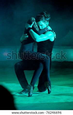 BARCELONA - APRIL 1: Couple in action during the spectacle Somnis (Dreams) of the circus Italiano on April 1, 2011, in Santa Coloma de Gramanet, Barcelona, Spain.