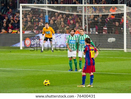 BARCELONA - JANUARY 12: Leo Messi (10) shooting a free kick during the football Spanish Cup between FC Barcelona and Real Betis, final score 5 - 0, on January 12, 2011 in Barcelona, Spain.