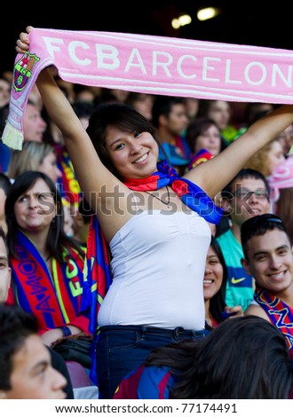 BARCELONA - MAY 13: Unidentified FC Barcelona supporter celebrates the Spanish League Championship victory in Camp Nou stadium, on May 13, 2011 in Barcelona, Spain.
