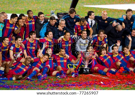 BARCELONA - MAY 15: FC Barcelona players receiving the cup and celebrating the Spanish League Championship victory in Camp Nou stadium, on May 15, 2011 in Barcelona, Spain.
