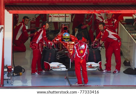 BARCELONA - FEBRUARY 18: Fernando Alonso (Ferrari) in the pits during Formula One Teams Test Days at Catalunya circuit February 18, 2011 in Barcelona (Spain).