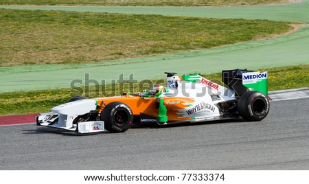 BARCELONA - FEBRUARY 18: Paul di Resta (Force India) tests his F1 car during Formula One Teams Test Days at Catalunya circuit February 18, 2011 in Barcelona (Spain).