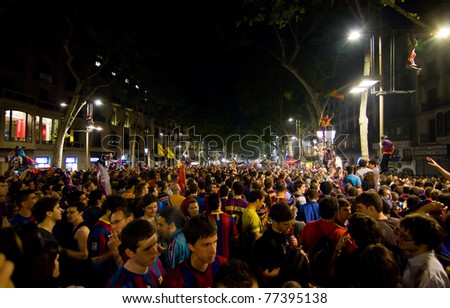 BARCELONA - MAY 11: Some supporters of FC Barcelona celebrate the Spanish League Championship victory in Catalunya square and Rambla street, on May 11, 2011 in Barcelona, Spain.