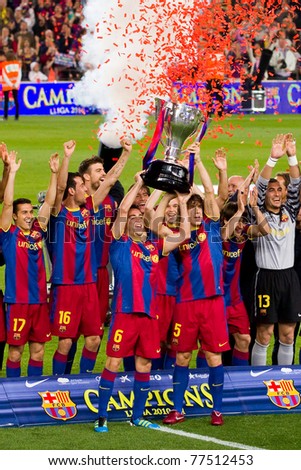 BARCELONA - MAY 15: FC Barcelona players receive the cup and celebrate the Spanish League Championship victory in Camp Nou stadium, on May 15, 2011 in Barcelona, Spain.