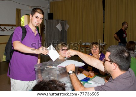 BARCELONA - MAY 22: Unidentified man votes at Spanish Municipal Elections, on May 22, 2011 in Barcelona, Spain.