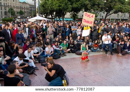 BARCELONA - MAY  19: People protest and do a peaceful sit-in against unemployment and political corruption during the Spanish Revolution days, on May 19, 2011 in Catalunya square, Barcelona, Spain.