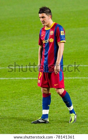 BARCELONA - JANUARY 16: David Villa in action during the football Spanish League match between FC Barcelona and Malaga, 4 - 1, in Camp Nou stadium, on January 16, 2011 in Barcelona, Spain.