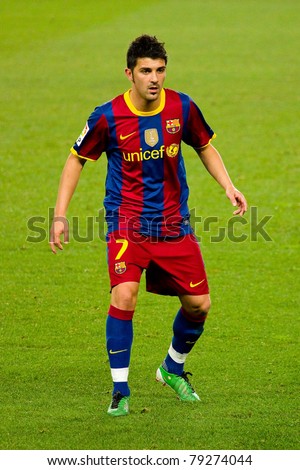 BARCELONA - DECEMBER 13: David Villa in action during the Spanish Soccer League match between FC Barcelona and Real Sociedad, 5 - 0, in Camp Nou stadium. December 13, 2010 in Barcelona, Spain.