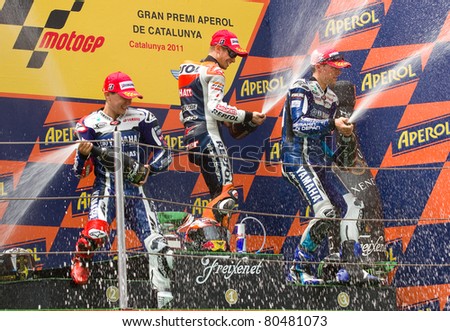 BARCELONA - JUNE 5: Casey Stoner (1st), Jorge Lorenzo (2nd) and Ben Spies (3rd) in the podium after the race of MotoGP Grand Prix of Catalunya, on June 5, 2011 in Barcelona, Spain.