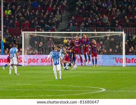 BARCELONA - JANUARY 16: Sergio Barbosa Duda of Malaga shooting a free kick during Spanish League match between FC Barcelona and Malaga, 4 - 1. January 16, 2011 in Camp Nou stadium, Barcelona, Spain.