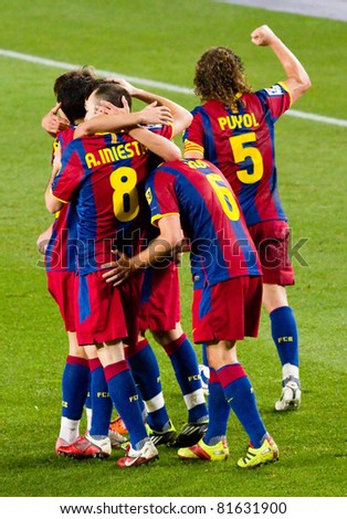 BARCELONA - JANUARY 16: Barcelona players celebrating a goal during Spanish League match between FC Barcelona and Malaga, 4 - 1. January 16, 2011 in Camp Nou stadium, Barcelona, Spain.