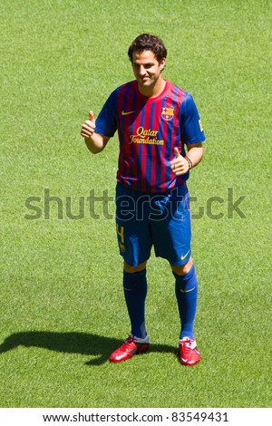 BARCELONA - AUGUST 15: Spanish footballer Cesc Fabregas during his presentation as new FC Barcelona player in Camp Nou stadium, on August 15, 2011, in Barcelona, Spain.