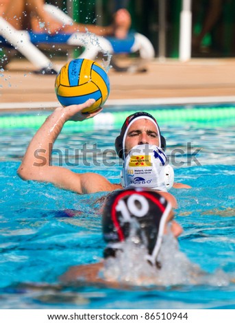 MATARO, SPAIN - OCTOBER 12: Unidentified water polo players in action during the Spanish League match between Mataro and CN Terrassa, final score 7-6, on October 12, 2011, in Mataro, Barcelona, Spain.