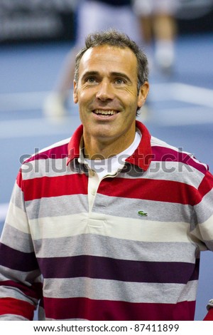 BARCELONA - OCTOBER 22: Alex Corretja in action during a tennis match organized as a tribute to Andreu Gimeno, on October 22, 2011, in Palau Blaugrana stadium, Barcelona, Spain.