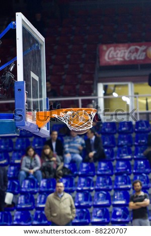 BARCELONA - MARCH 24: Ball inside the basket during the Euroleague basketball match between Barcelona and Panathinaikos, 71-75, on March 24, 2011 in Barcelona, Spain.