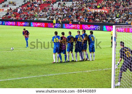 BARCELONA - AUGUST 9: Carlos Carmona of Barcelona shooting a free kick during the Catalunya Cup final match between RCD Espanyol and FC Barcelona, 3 - 0, on August 9, 2011 in Tarragona, Spain.