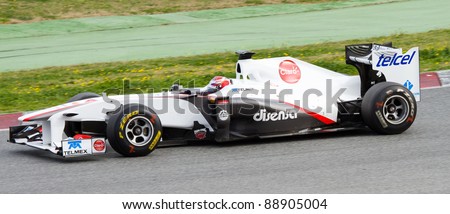 BARCELONA - FEBRUARY 18: Kamui Kobayashi of Sauber team drives his F1 car during Formula One Teams Test Days at Catalunya circuit, on February 18, 2011 in Barcelona, Spain.