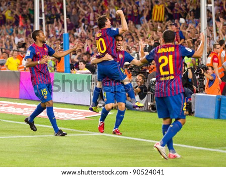 BARCELONA - AUGUST 17: Players celebrates the goal of Leo Messi during the Spanish Super Cup final match between FC Barcelona & Real Madrid, 3 - 2, on August 17, 2011 in Barcelona, Spain.
