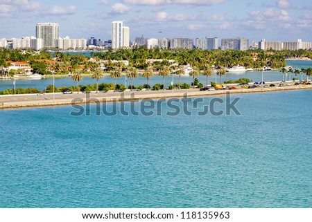 Miami coast from across the water on sunny day.