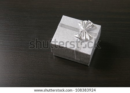 Gift box on table close-up abstract background