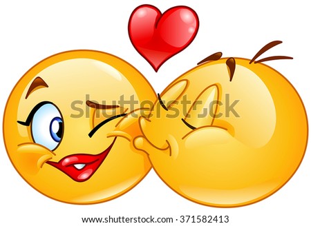 Kissing emoticons. Male emoticon kissing a female emoticon.