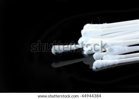 cotton buds isolated on black