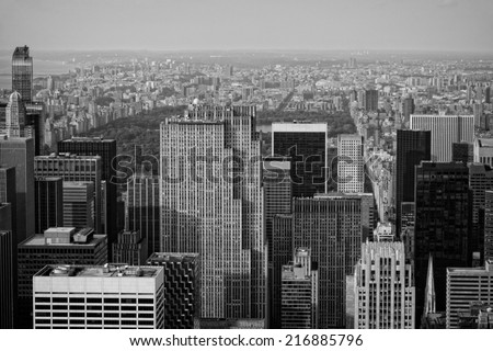 A black and white image of New York City taken from above overlooking Central Park.