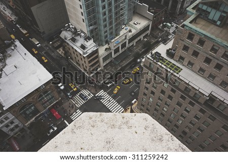 NEW YORK CITY - August 22:  A bustling New York City street scene taken from above on August 22, 2015.  Matte finish applied.