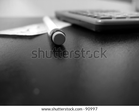Black and white desktop still life, focus on eraser