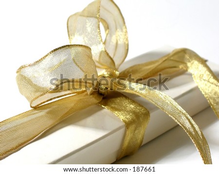 Gift box with gold ribbon and bow
