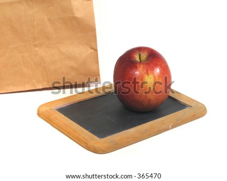Brown bag lunch, apple and chalkboard