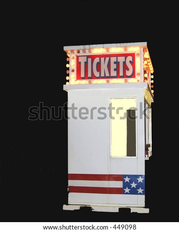 Lit ticket booth at carnival; isolated on black