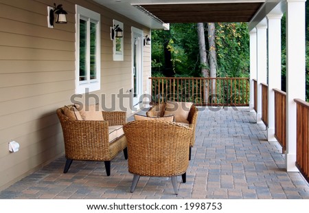 Wicker furniture on deck with stone tile floor