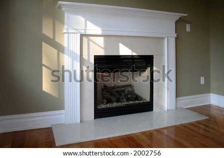 Fireplace in sunny room with white mantle; ambient window light
