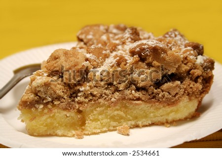 Cake with crumb topping on paper plate