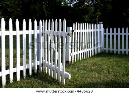 Inviting white picket fence with gate opened welcomes you