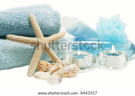 Spa essentials and skin care items in blue with starfish and sea shells