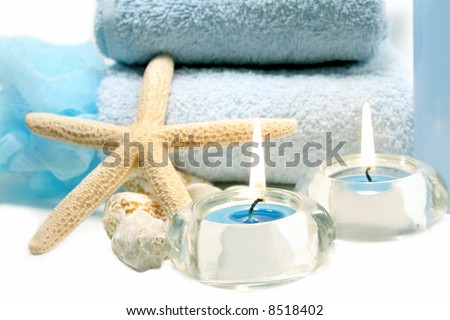 Spa essentials and skin care items in blue with starfish and sea shells
