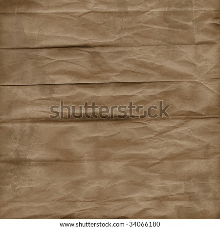 Wrinkled and creased brown textured paper background