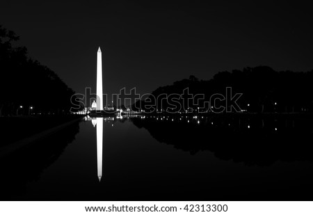 The Washington Monument in Washington DC in black and white at night.