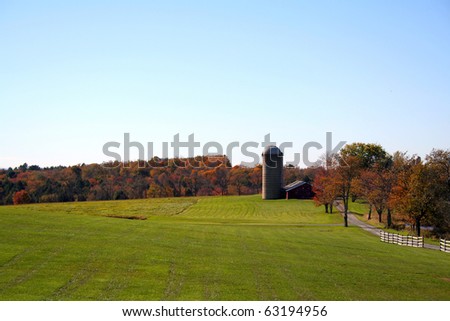 The beautiful colors of autumn surround this rural country farm in rural New York, Catskill Mountains