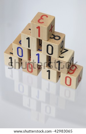 Stack of Wooden Blocks with binary code on White Background