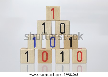 Stack of Wooden Blocks with binary code on White Background