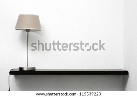 shelf on the wall with lamp