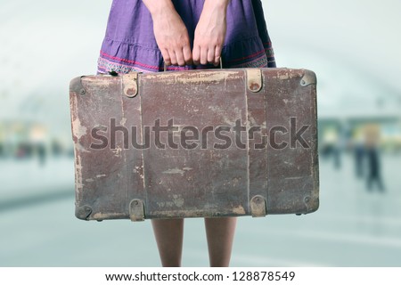 woman with luggage at the airport